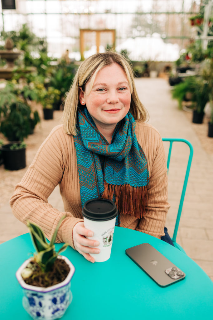 Park City, Utah real estate agent photoshoot with a coffee in a greenhouse - Becca Hofmann Photography