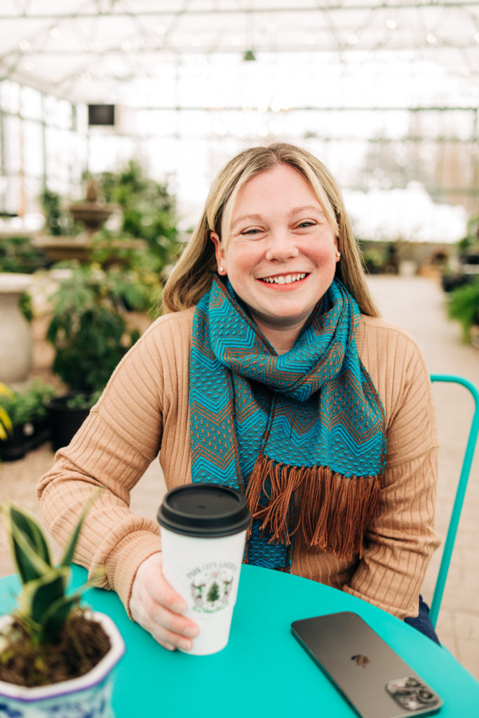 Park City, Utah real estate agent photoshoot with a coffee in a greenhouse - Becca Hofmann Photography